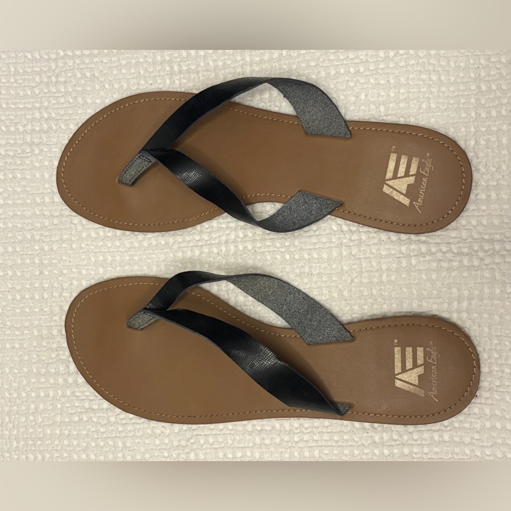 Black leather flip flops